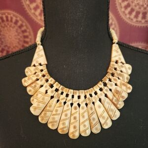 Tribal carved necklace.